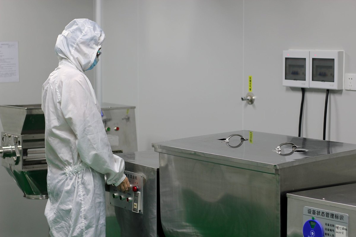 Packaging and inspection station at a dietary supplement factory in Guangzhou